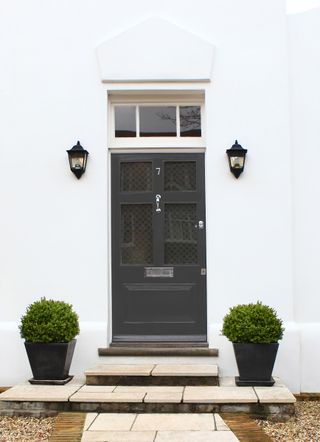 black front door on white stucco house