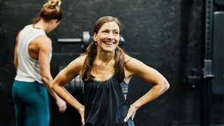 Woman smiling in the gym in workout clothes