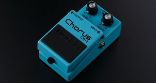 Boss CE-2 Chorus: the compact blue chorus pedal is pictured against a dark background.