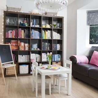 playroom with bookshelves and blackboard