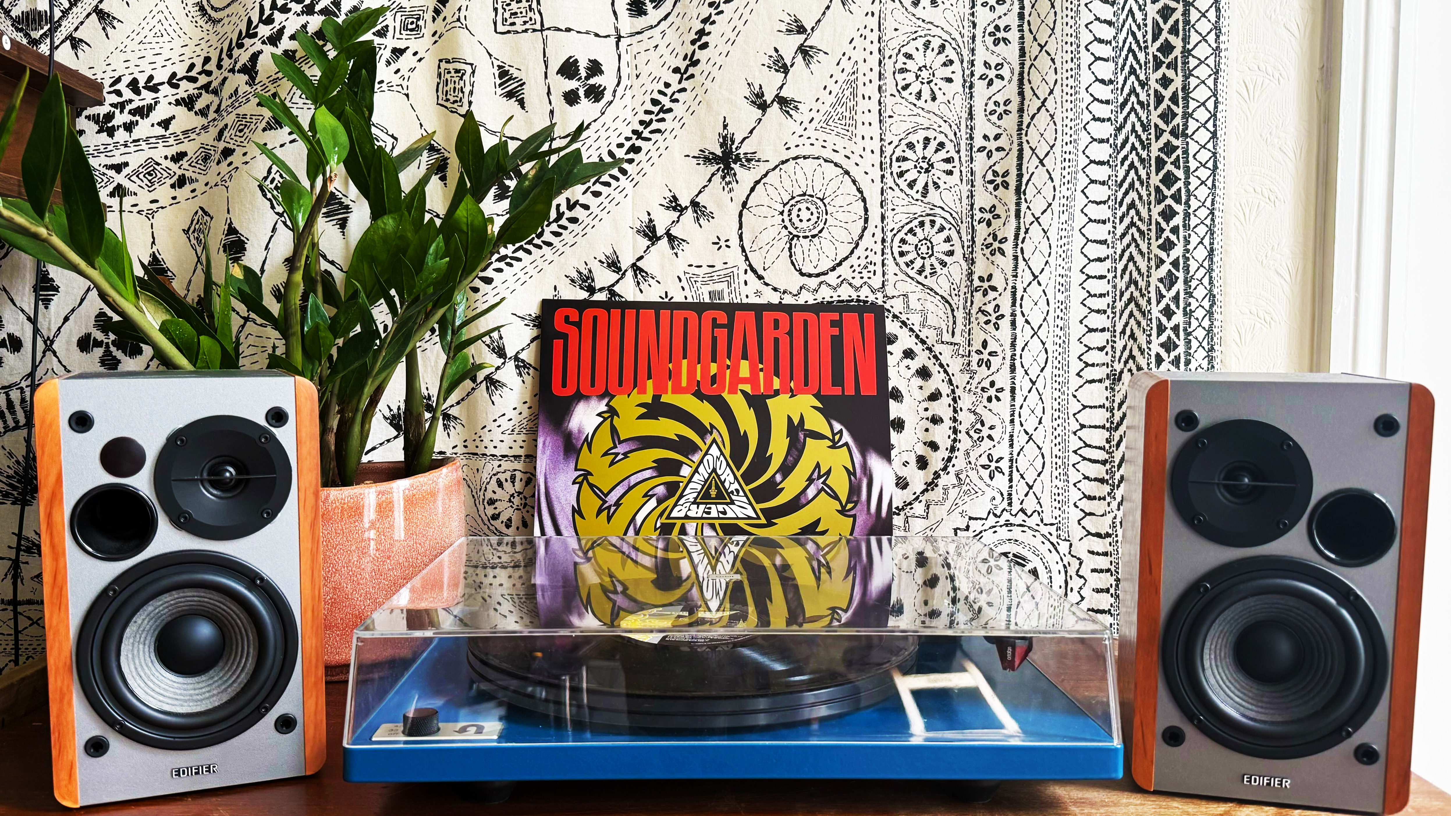 the u-turn audio orbit special turntable with edifier r1280t speakers and a soundgarden record