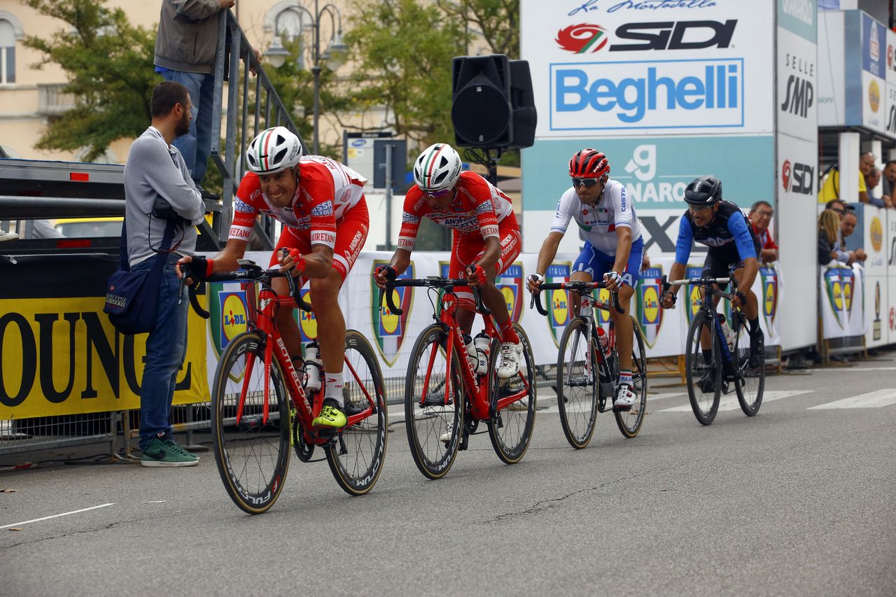 The four-man lead group on the finishing circuit