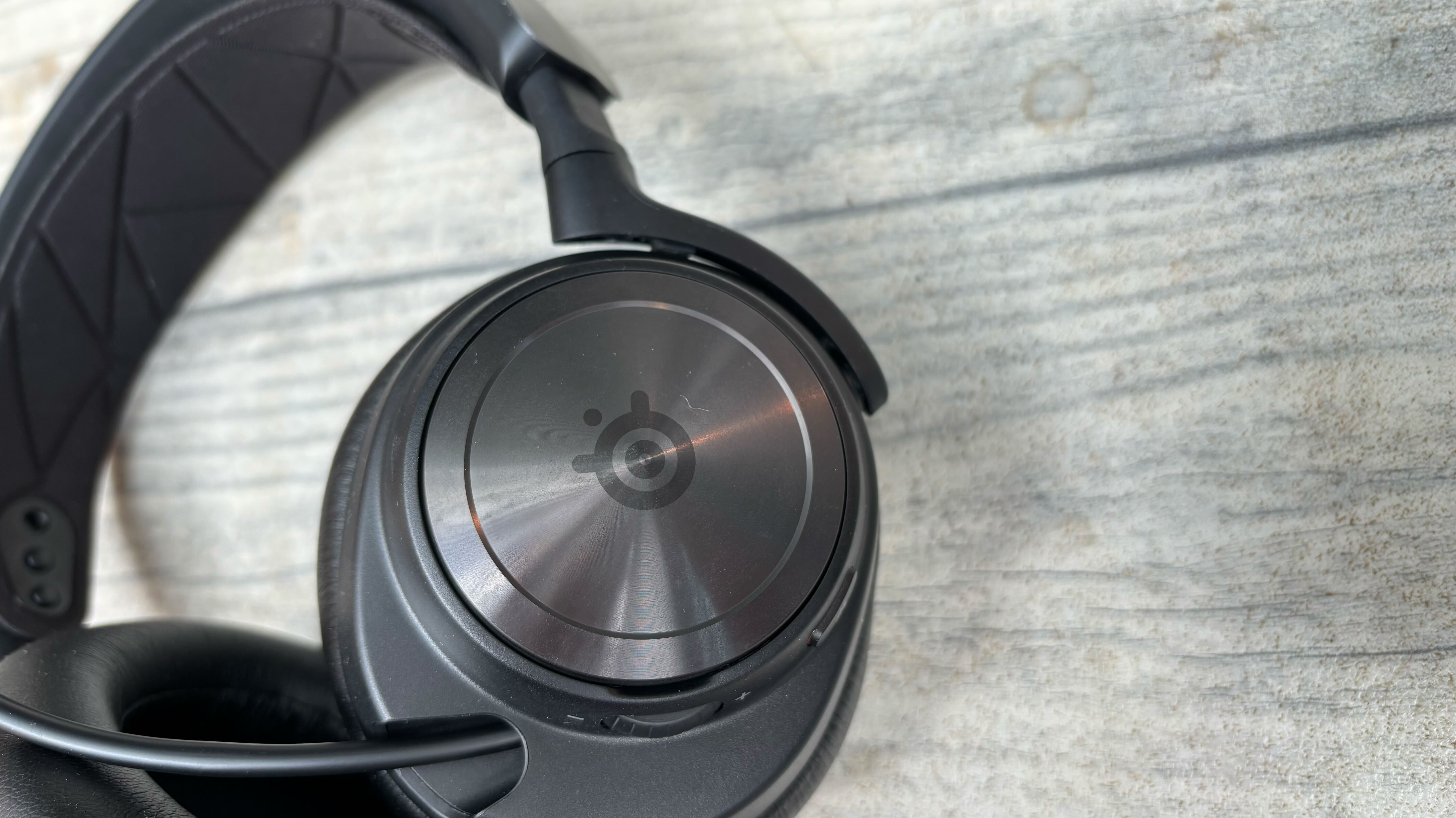 SteelSeries Arctis Nova Pro on a wooden surface