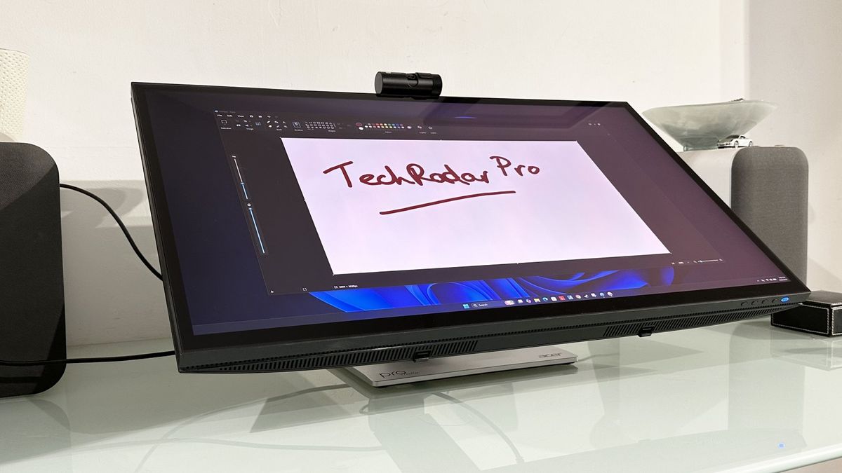 The Acer ProDesigner PE320QXT on a desk in a home office during our testing process