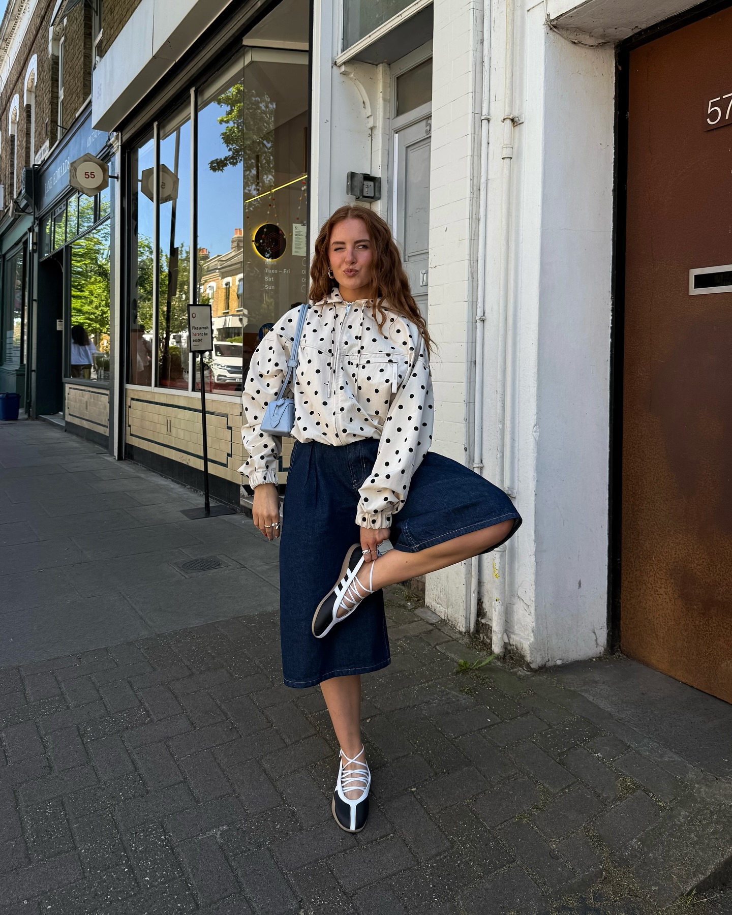 An image of @rebeccaferrazwyatt wearing Adidas Taekwondo trainers, one of the best summer trainers.