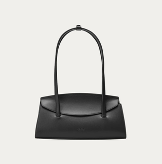 a freja nyc bag in front of a plain backdrop