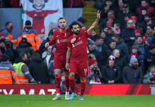 Liverpool’s Mohamed Salah celebrates scoring their side’s second goal of the game during the Premier League match at Anfield, Liverpool. Picture date: Saturday February 19, 2022