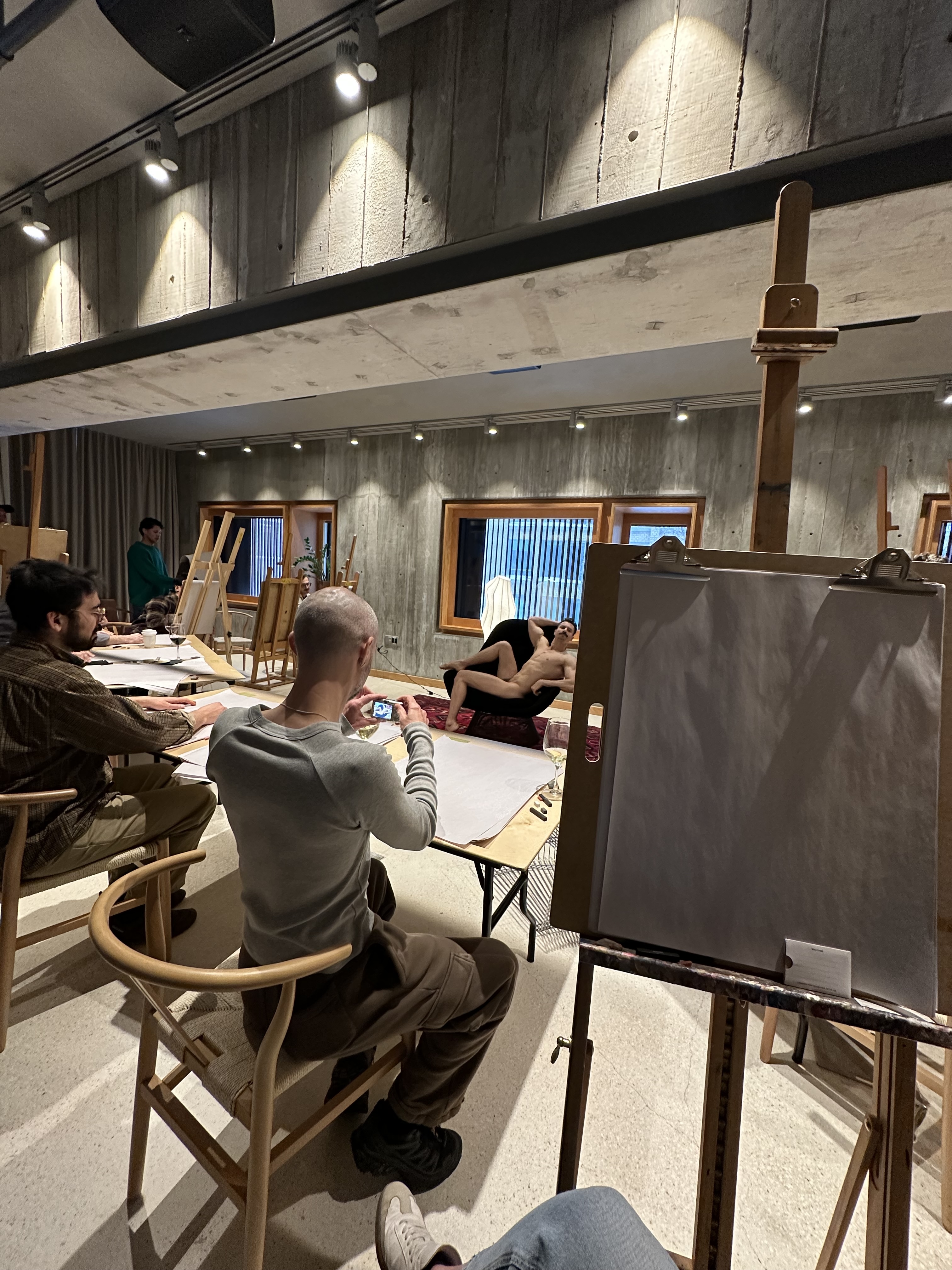 life drawing class with nude model and easels