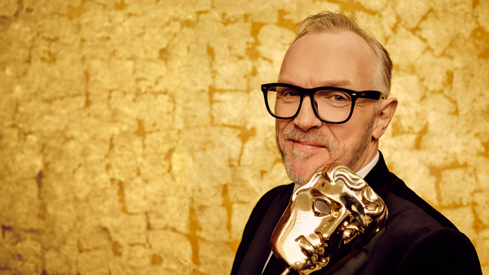 Greg Davies with a BAFTA award