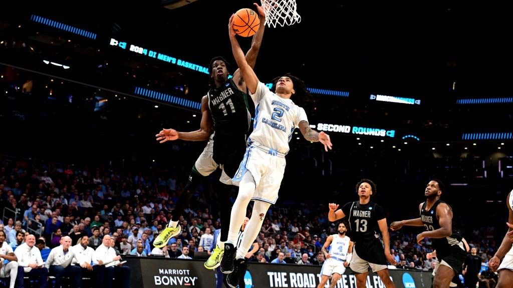 Melvin Council Jr. #11 of the Wagner Seahawks defends a shot by Elliot Cadeau #2 of the North Carolina Tar Heels during the second half of the first round of the NCAA Men&#039;s Basketball Tournament at Spectrum Center on March 21, 2024 