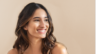Smiling woman with brunette balayage