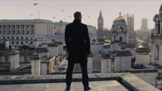 Daniel Craig looks out at London on the roof in Skyfall.