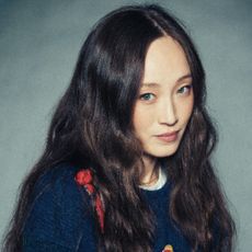 havana rose liu wears her hair in waves down long and a sweater in a headshot