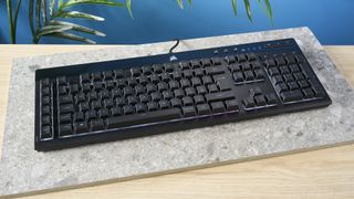 A black Corsair K55 RGB Pro wired gaming keyboard with rubber dome switches