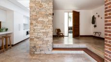 A clutter free entryway with beige, bright tones 