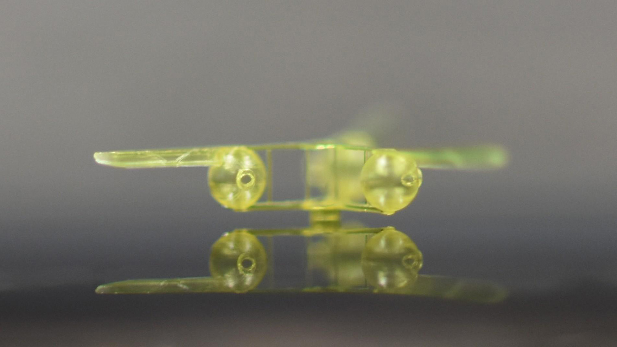 A close up of a green robot