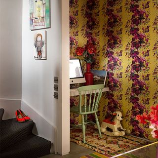 studious zone with floral wallpaper chair and desk