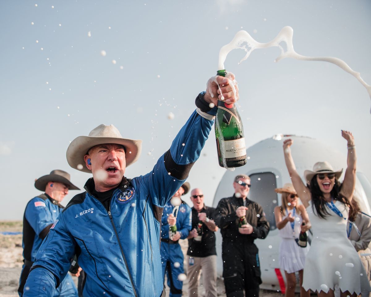 Blue Origin founder Jeff Bezos celebrates his company&#039;s first crewed flight, on which he was a passenger, on July 20, 2021.