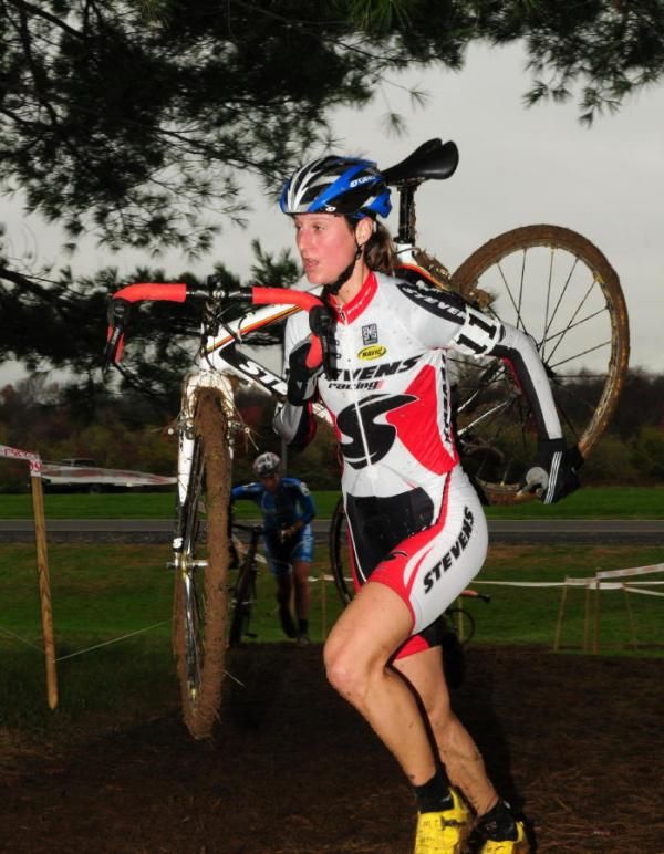 Rebecca Wellons (Stevens Cycles) pushing her bike up the hill.