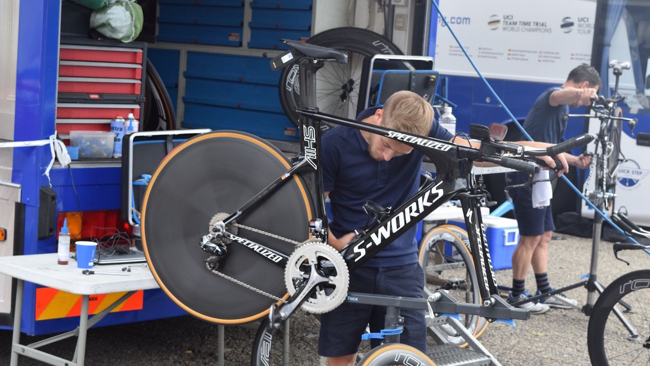 A Quick-Step mechanic works on Enrico Mas' Specialied Shiv, another bike to feature the 58T chainrings