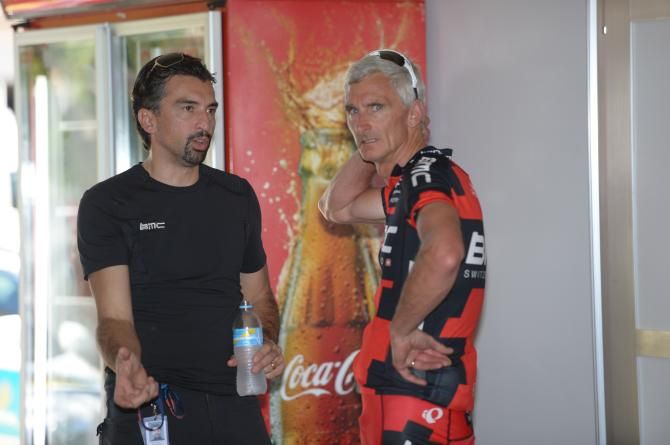 Directeur sportif Fabio Baldato talks to sporting manager Allan Peiper before training