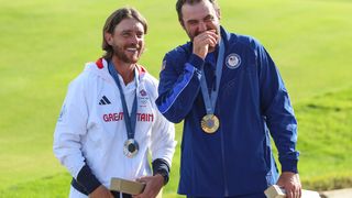 Tommy Fleetwood and Scottie Scheffler after receiving their Olympics gold medals