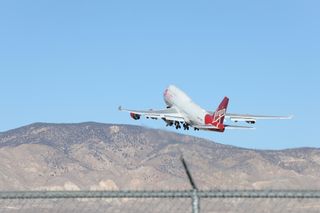 Virgin Orbit's LauncherOne rocket lifts off beneath the wing of the Cosmic Girl carrier plane from California's Mojave Air and Space Port on Jan. 17, 2021.