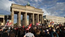 People gather in Berlin to protest the AfD&rsquo;s victory in state elections.