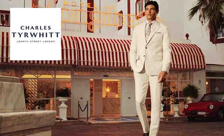 charles tyrwhitt logo top left with a man in a white suit 