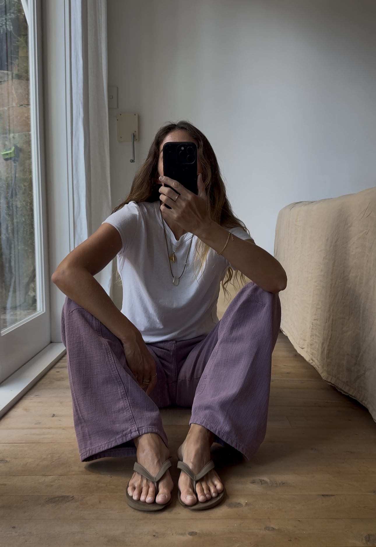 Angie wears a S&amp;eacute;zane blazer, black trousers and woven brown bag