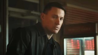 Channing Tatum looks at Scarlett Johannson mysteriously in Fly Me To The Moon