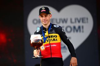 HARELBEKE BELGIUM MARCH 25 Wout Van Aert of Belgium and Team Jumbo Visma celebrates at podium with a beer as race winner during the 65th E3 Saxo Bank Classic 2022 a 2039km one day race from Harelbeke to Harelbeke E3SaxobankClassic WorldTour on March 25 2022 in Harelbeke Belgium Photo by Tim de WaeleGetty Images
