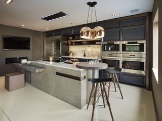 A modern kitchen with assortment of kitchen island seating areas