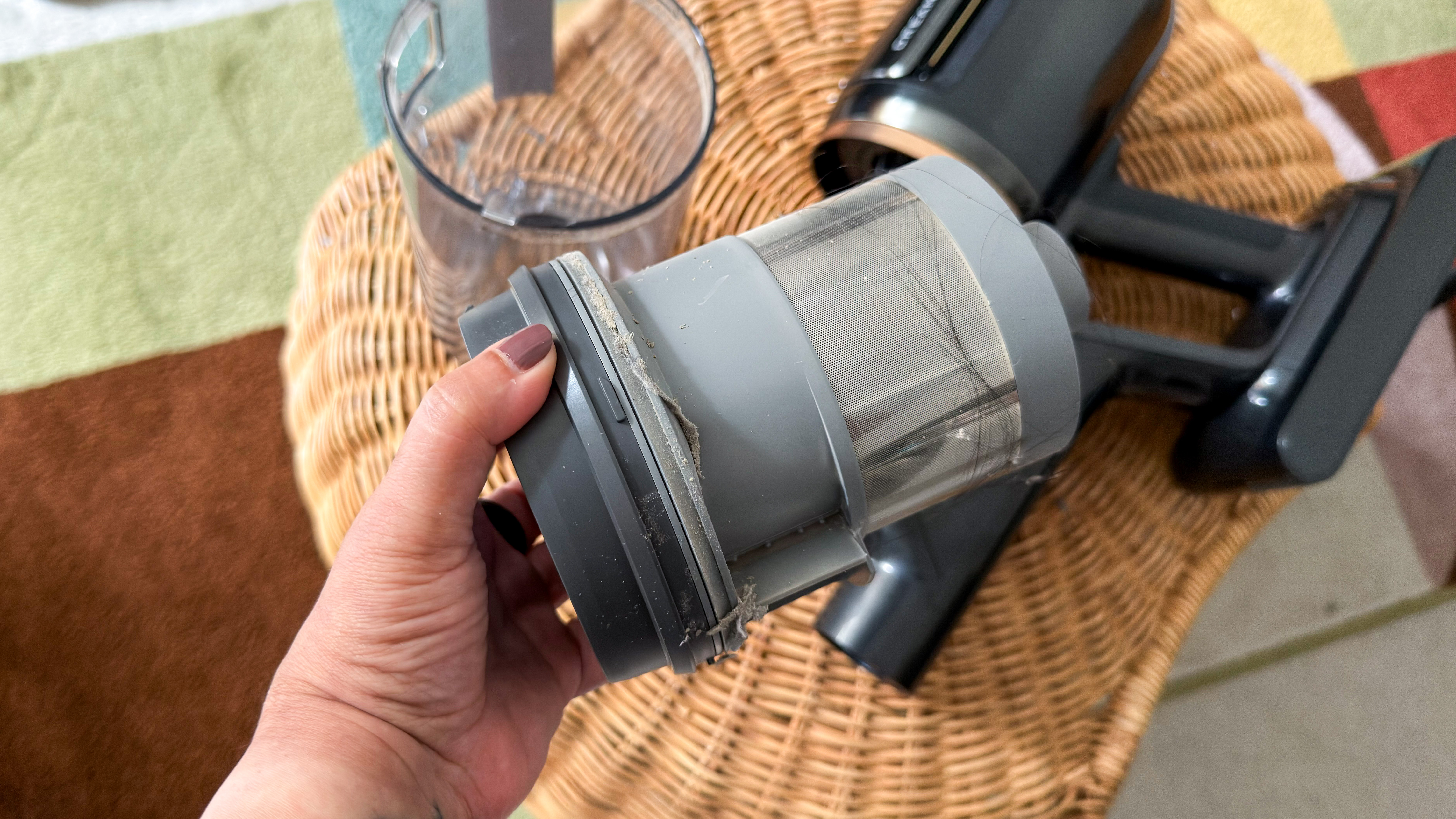 Dust and hair inside the dismantled dust cup of the Dreame Z50 Station