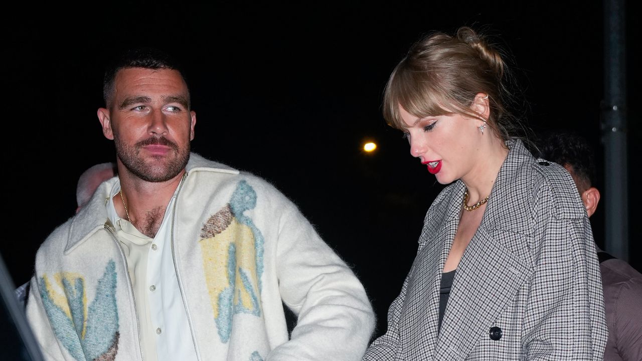 Travis Kelce and Taylor Swift walking