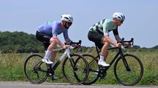 Art Director Dan and tech editor Andy riding the boardman SLR 9.0 and Specialized Allez wearing purple and green jerseys