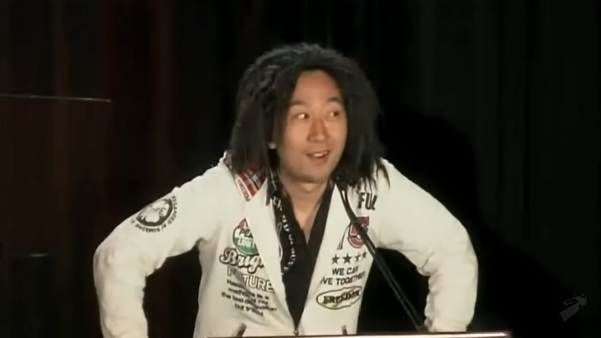 Komani producer Tak Fujii looks slyly to the side