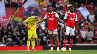 Aaron Ramsdale, Gabriel and Thomas Partey look dejected during Arsenal's 3-0 loss at home to Brighton in May 2023.
