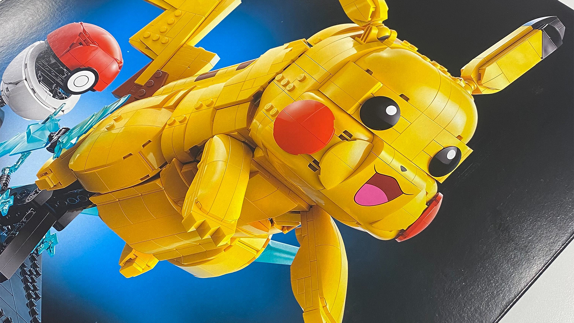 Lego Pikachu and Poke Ball set against a dark background