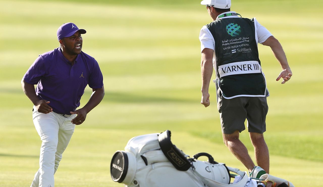 Varner celebrates with caddie