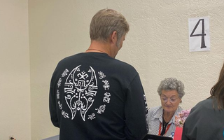 A picture of Albuquerque mayor Tim Keller wearing a Soulfly t-shirt