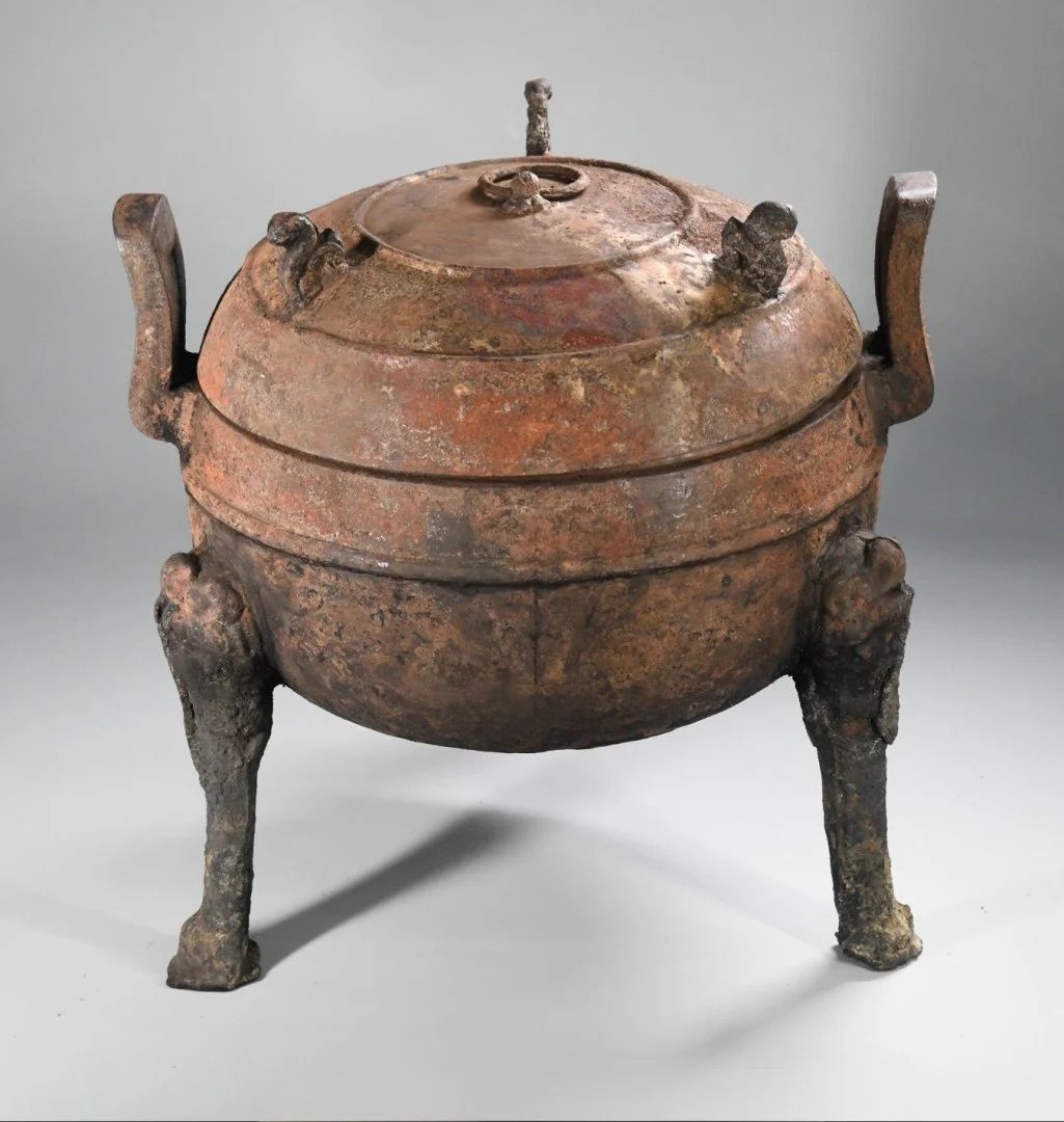 Round pottery figurine atrifact recovered from the tomb.