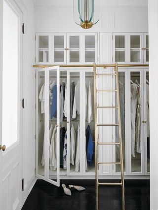 white fitted wardrobe with glass doors