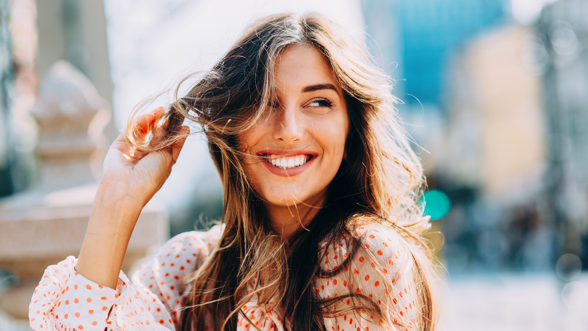 best shampoo for dandruff - best shampoo for dandruff - Woman looking off into the distance with wavy hair gettyimages -636115754