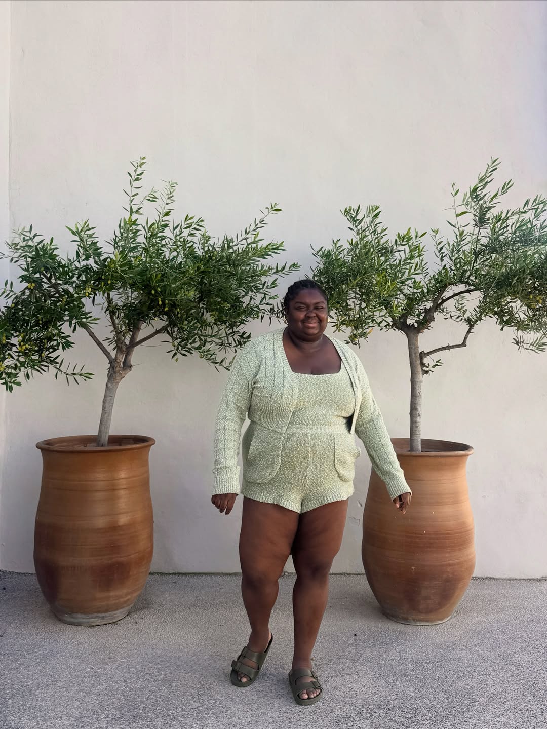 Abisola wearing pistachio green knit shorts