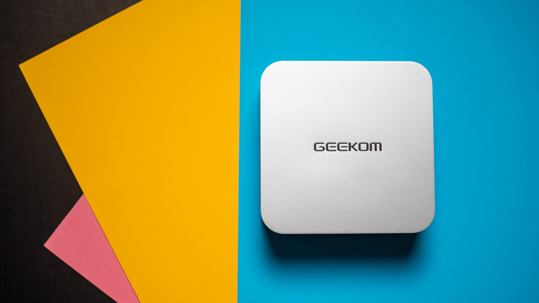 Geekom A8 design highlighted against colorful background