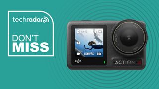 An action camera on a green background