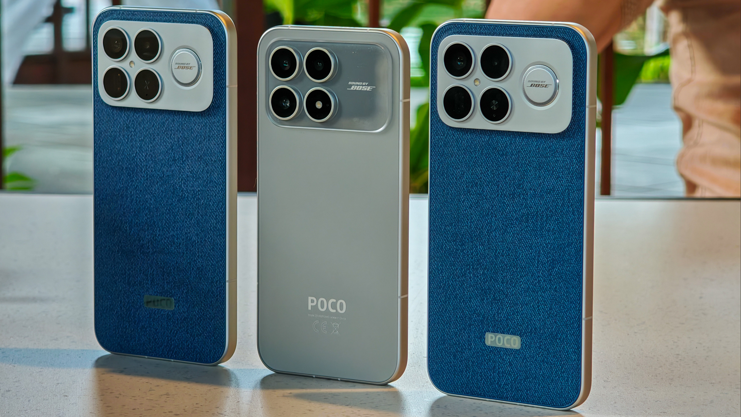 Poco F8 Pro in the hand in silver