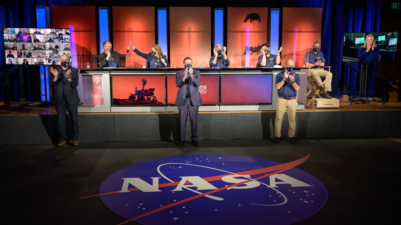 NASA Perseverance rover mission management and scientist celebrate a successful landing on Mars at the start of a post-landing update, Thursday, Feb. 18, 2021, at NASA's Jet Propulsion Laboratory in Pasadena, California.