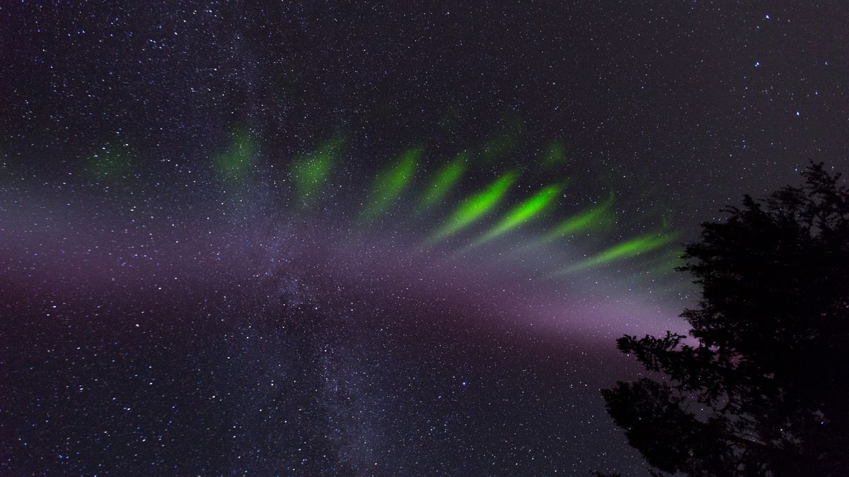 green streaks of light dot the night sky